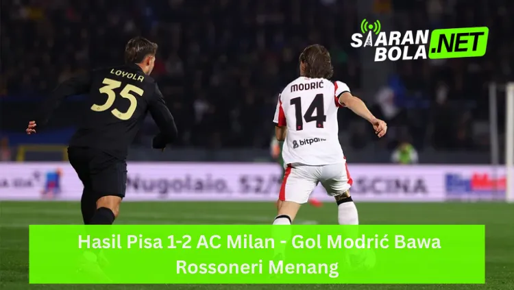 Tampilan punggung Luka Modrić mengenakan jersey putih AC Milan bernomor punggung 14 dengan nama "MODRIC" sedang berlari di lapangan; di depannya terdapat pemain Pisa bernomor 35 "LOYOLA" dengan jersey hitam; terdapat logo SIARANBOLA.NET hijau di pojok kanan atas dan teks "Hasil Pisa 1-2 AC Milan - Gol Modrić Bawa Rossoneri Menang" pada bilah hijau terang di bagian bawah.
